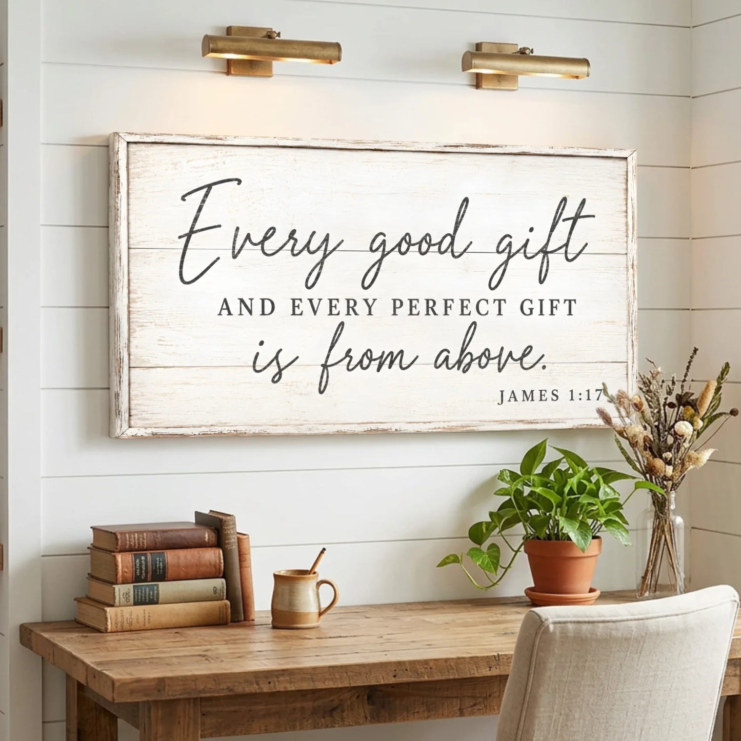 Decorative sign with inspirational quote above a wooden desk with books and plants. Every Perfect Gift Is From Above - James 1:17