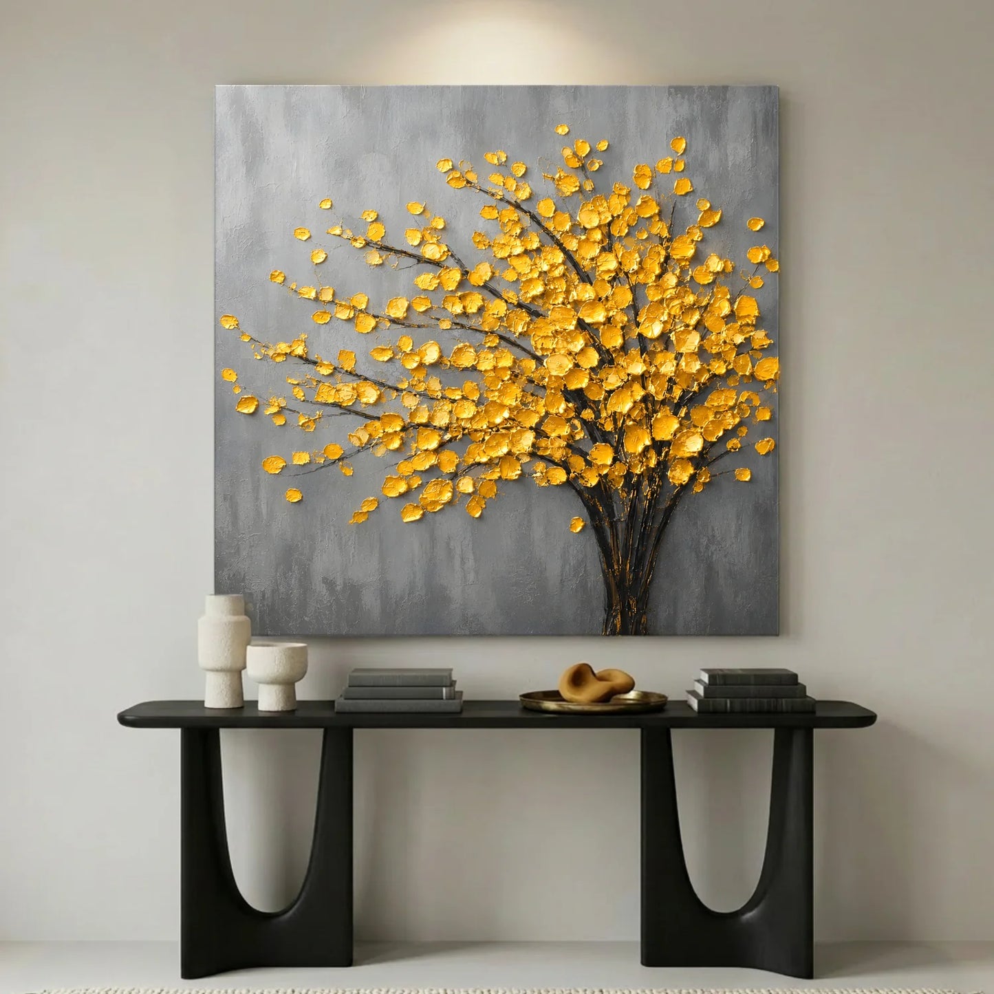 Decorative wall art with yellow floral design on a gray background, displayed above a black console table.