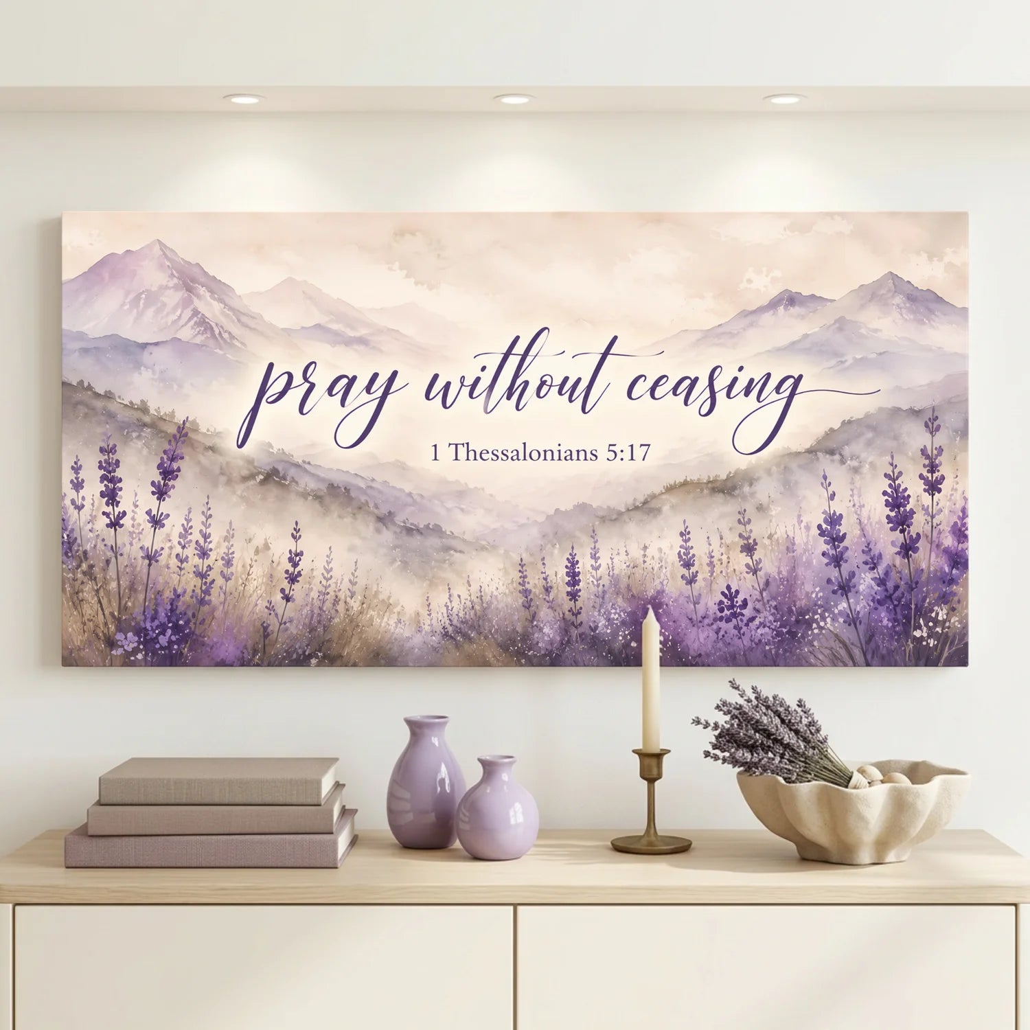 Decorative wall art with lavender and mountains on a wall above a cabinet.