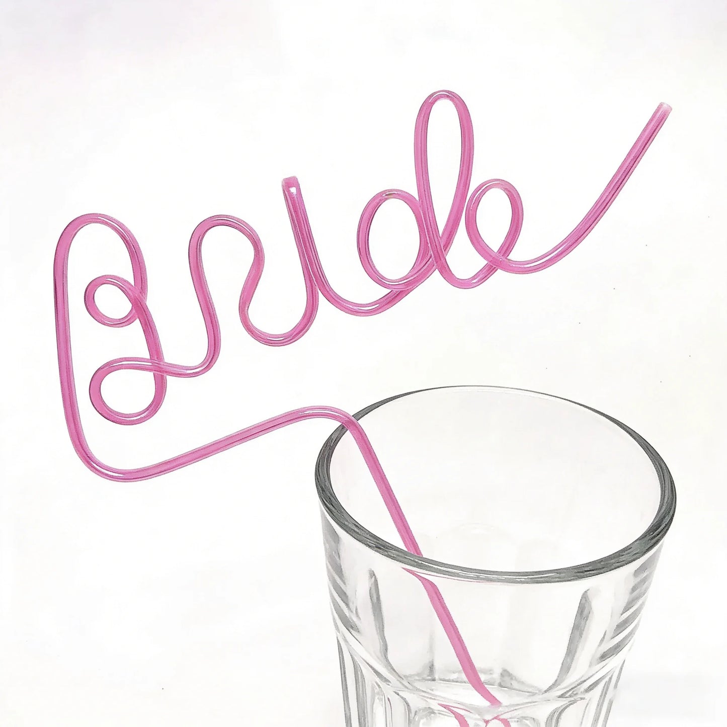 Pink bride drinking straw set for bachelorette party, shown in gift box bridal shower display.