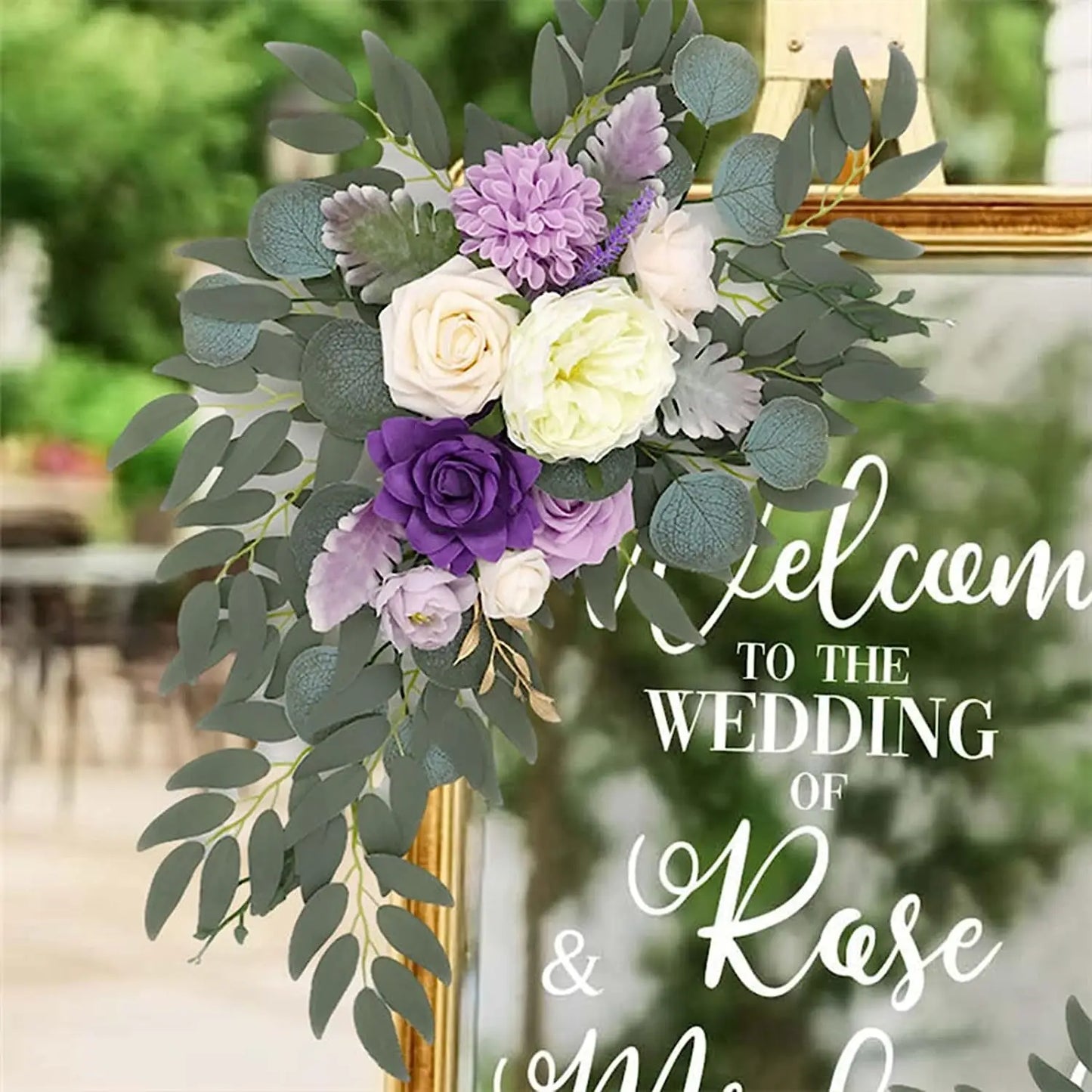 Artificial silk floral swag pair in champagne rose, shown on rustic wedding welcome sign backdrop.