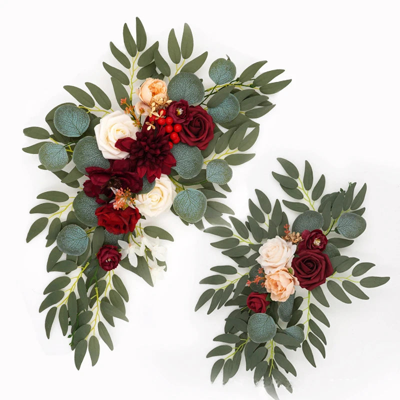 Artificial silk floral swag pair in champagne rose, shown on rustic wedding welcome sign backdrop.