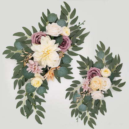 Artificial silk floral swag pair in champagne rose, shown on rustic wedding welcome sign backdrop.