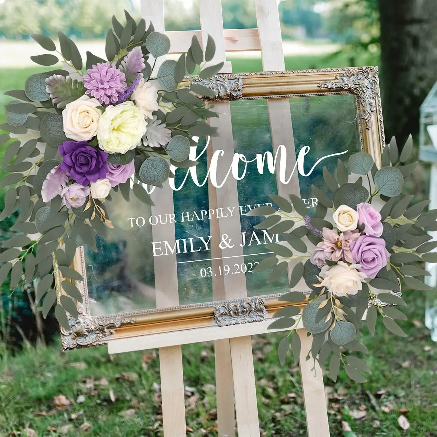 Artificial silk floral swag pair in champagne rose, shown on rustic wedding welcome sign backdrop.