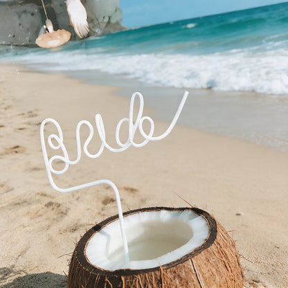 Pink bride drinking straw set for bachelorette party, shown in gift box bridal shower display.