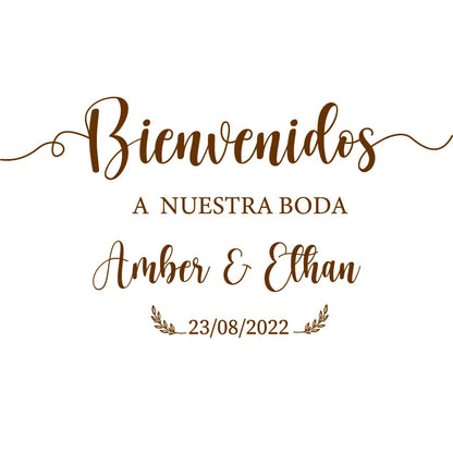 Personalized 'Bienvenidos' Spanish wedding welcome mirror decal in gold vinyl, shown on welcome sign board display.