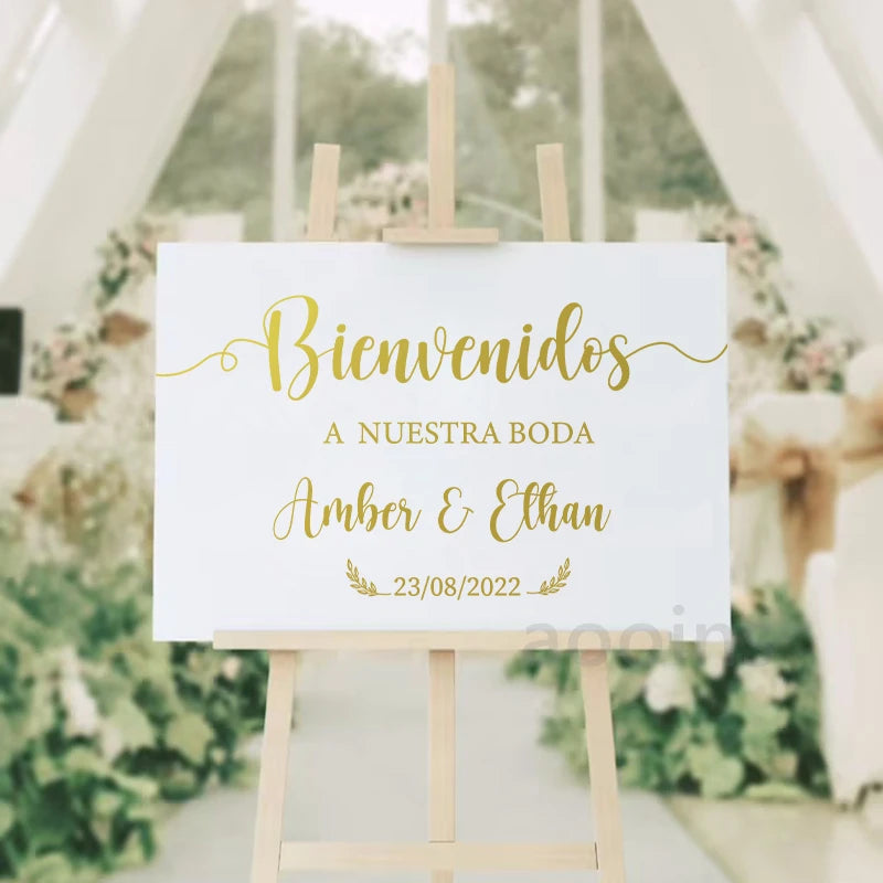 Personalized 'Bienvenidos' Spanish wedding welcome mirror decal in gold vinyl, shown on welcome sign board display.