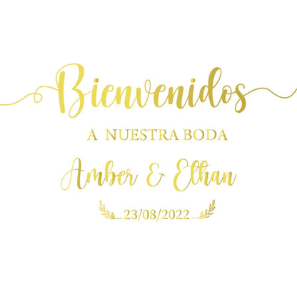 Personalized 'Bienvenidos' Spanish wedding welcome mirror decal in gold vinyl, shown on welcome sign board display.
