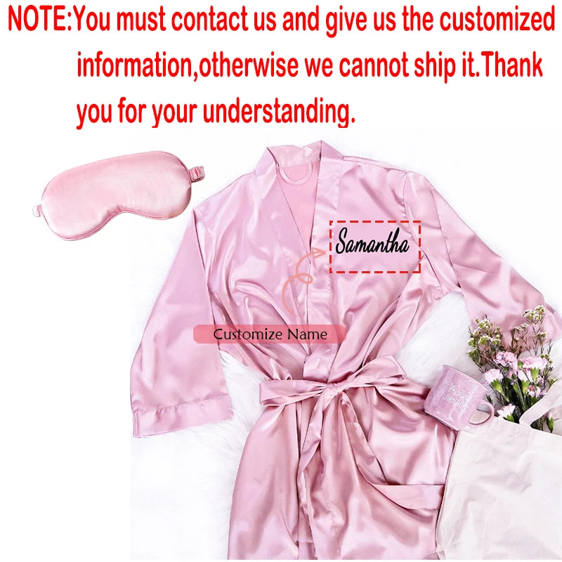Personalized soft satin bridesmaid robe in custom pink with matching eye mask, shown on bachelorette gift display.