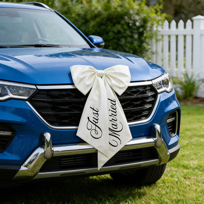 'Just Married' wedding car bow ribbon in white, shown on bridal getaway vehicle decoration display.