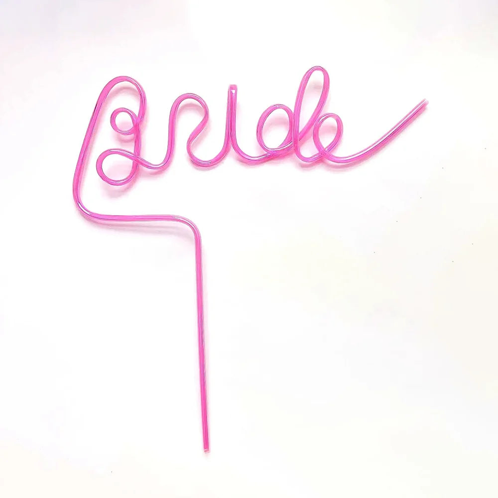 Pink bride drinking straw set for bachelorette party, shown in gift box bridal shower display.