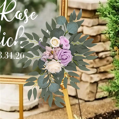 Artificial silk floral swag pair in champagne rose, shown on rustic wedding welcome sign backdrop.