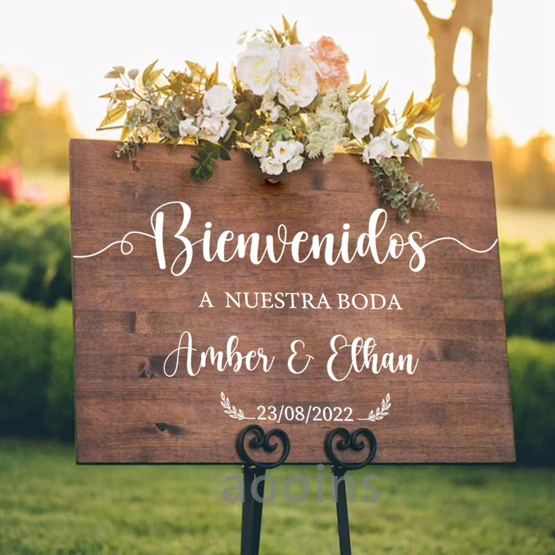 Personalized 'Bienvenidos' Spanish wedding welcome mirror decal in gold vinyl, shown on welcome sign board display.