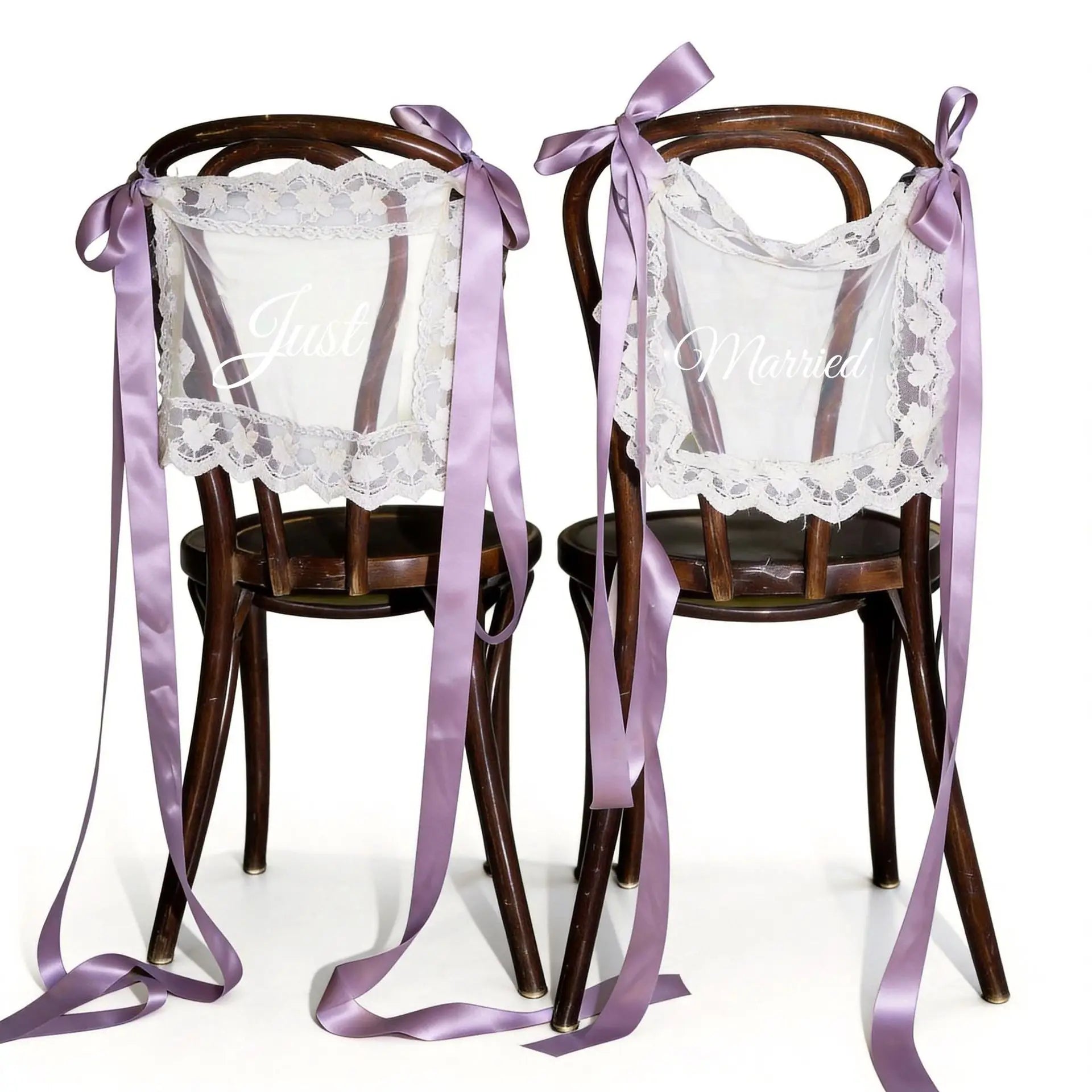 Sheer lace 'Just Married' chair sign set with 'Bride' and 'Groom' lettering, shown on wedding sweetheart table chair display.