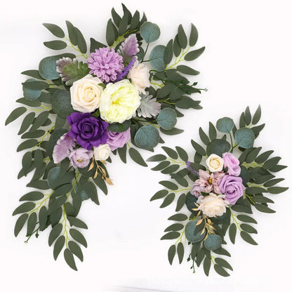 Artificial silk floral swag pair in champagne rose, shown on rustic wedding welcome sign backdrop.