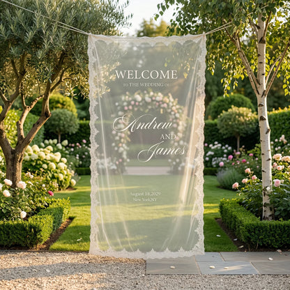 Personalized lace fabric wedding welcome banner with embroidered custom names and date, shown on outdoor ceremony display.