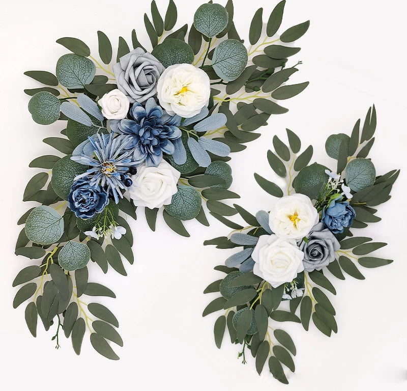 Artificial silk floral swag pair in champagne rose, shown on rustic wedding welcome sign backdrop.