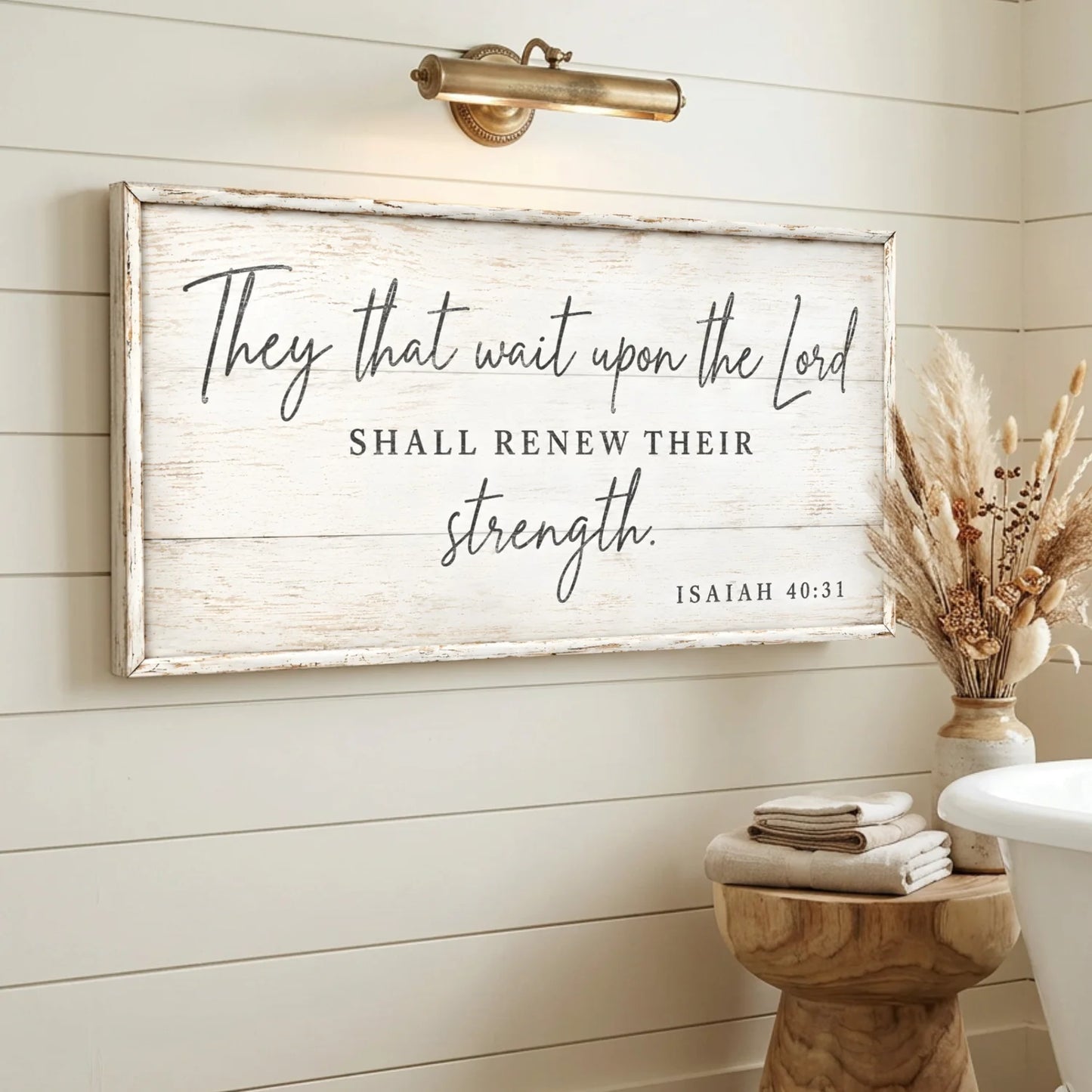 Decorative sign with inspirational quote on a wall in a bathroom setting. They That Wait Upon The Lord - Isaiah 40:31
