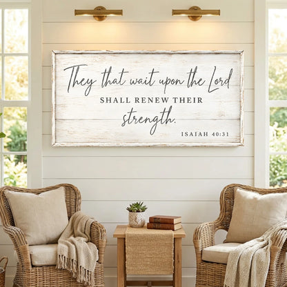 Living room with wicker chairs, a small table, and a motivational quote sign on the wall.